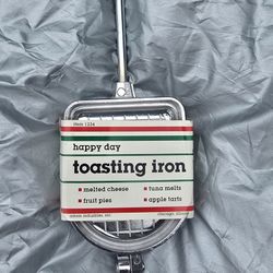 Camping Toasting Irons By The Fire 