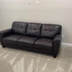 Like new, never used Italian leather sofa dark brown