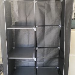 Portable Closet With Shelves And A Pole To Hang Clothes $20
