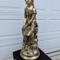 Painted Lady On The Rocks Statue