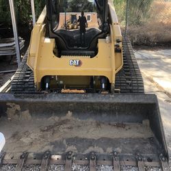 Skid Steer And Excavator Work 