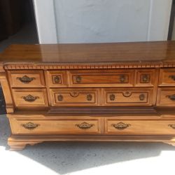 Dresser with mirror. Slight discoloration in one spot . Solid wood. Item in Escondido.