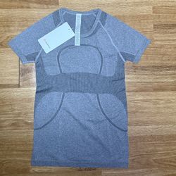 Swiftly Tech short sleeve “Waist Length” . Size M