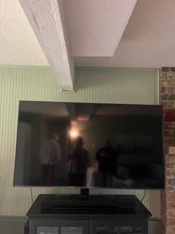 Barely used 76 inch Smart TV with swivel and sound bar