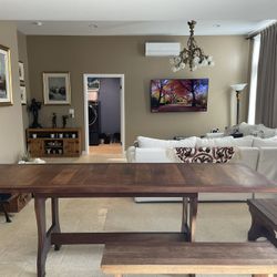 Hand carved wooden table set originally from Mendoza, Argentina. In excellent condition. Made for indoor spaces or covered outdoor. Includes 6 benches