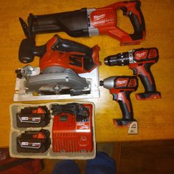 Milwaukee M18 4 Tool Kit With Six And A Half Inch Circular Saw A Full-size Sawzall Impact Driver Hammer Drill New Batteries And Charger