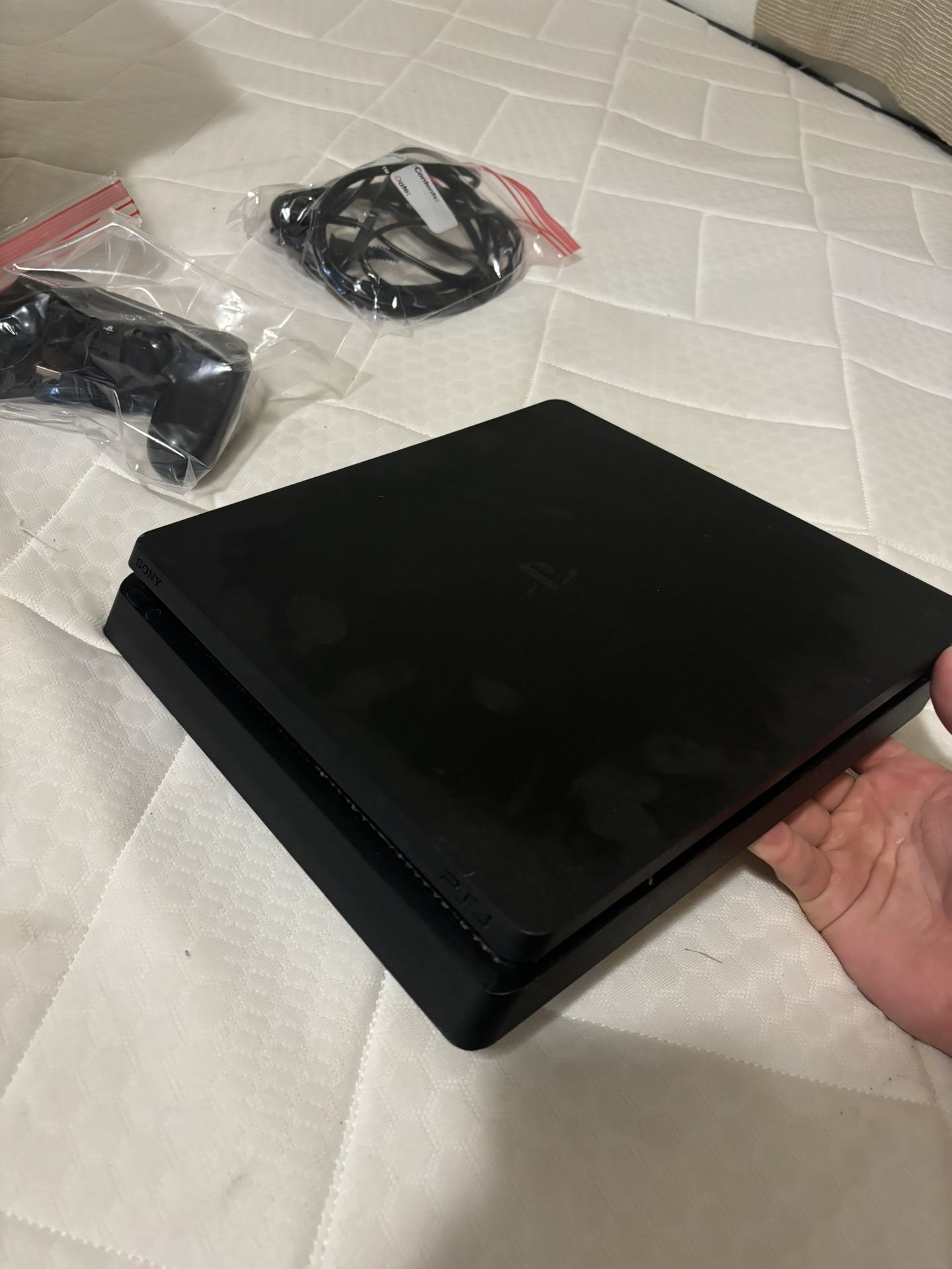 PlayStation 4 Slim with controller