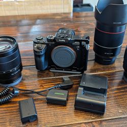 Sony A7Sii Camera W/ Lenses, Charger, Batter And Dummy Battery
