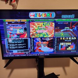 Computer with Batocera arcade. PC, PC game pad, 33 inch HD TV, and TV stand. You also connect Xbox controls, ni tendo switch controls, and more for ea