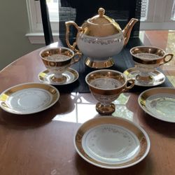Gold And White Porcelain Teapot With Parts Of A Bavaria Demitasse Set