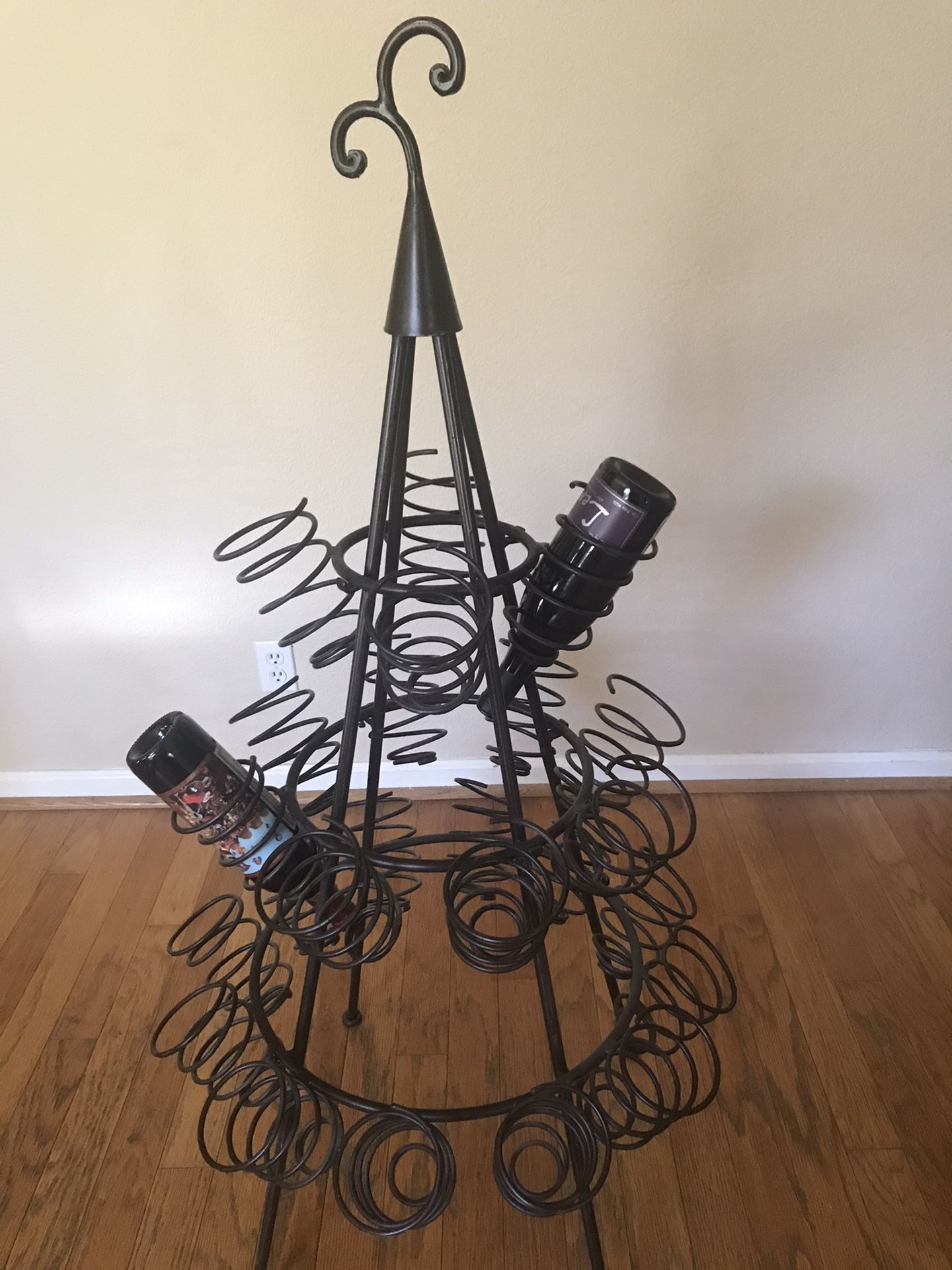 Rod iron wine rack from Pier One. Holds 24 bottles. Perfect Condition.