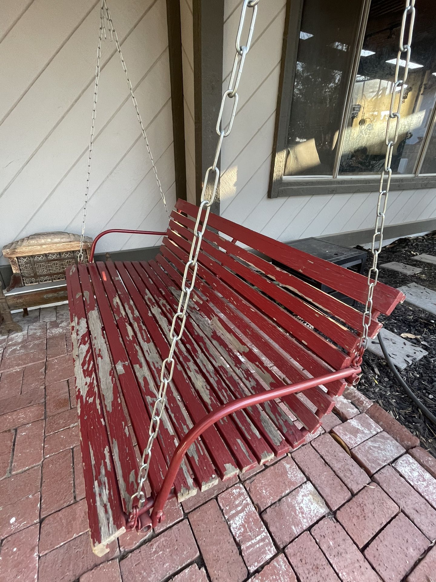 Porch patio wooden swing  Needs a new paint job, otherwise it has great bones $120