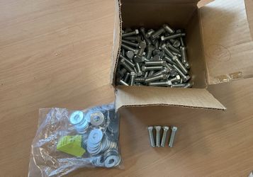 box of mixed flat washers and hex-top screws