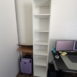 2 white book shelves 