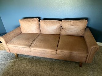 Tan midcentury modern faux leather couch