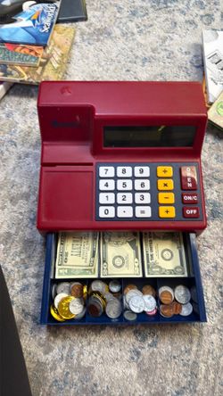 Play cash register with money and coins
