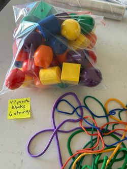Young kids jumbo plastic beads and laces