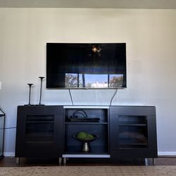 IKEA Entertainment Center With Sliding Doors And Glass Top. 