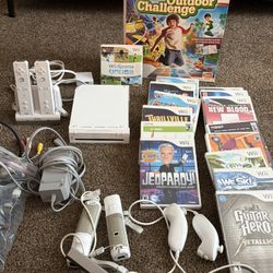 WII VIDEO GAME  W/ Controllers an 16 Games