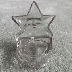 Star Shaped Votive Candle Holder Made Of Glass With A Face Molded Into The Star