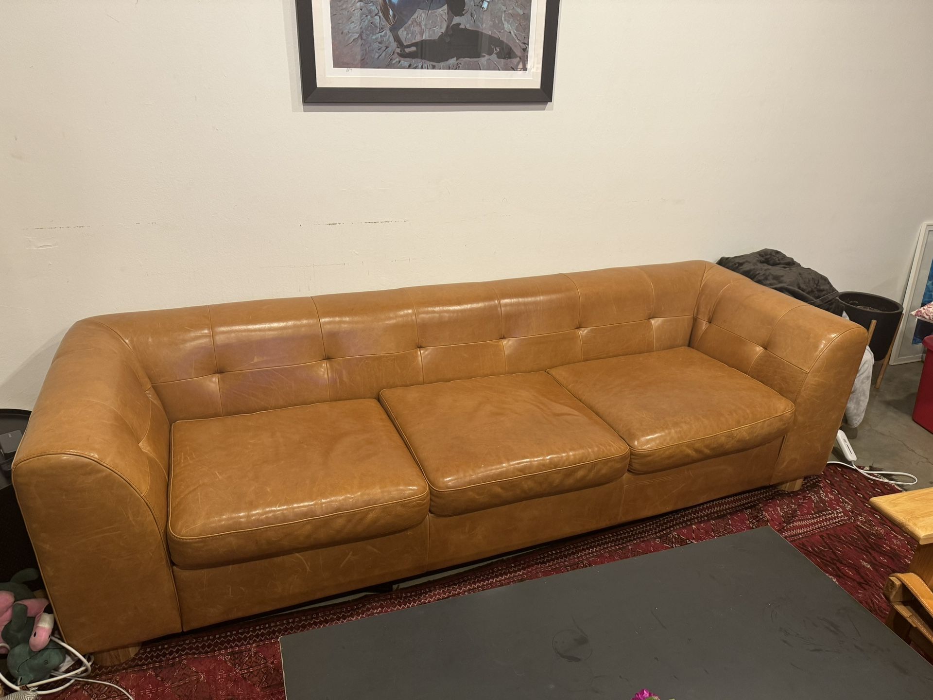 CB2 + GQ "Kotka" tobacco tufted leather sofa
