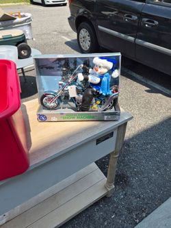 Dan D ee musical animated snow machine. he's a snowman on a musical motorcycle. New