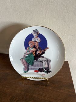 Norman Rockwell Collector Plate, featuring a man playing the ukulele for a woman, 8”