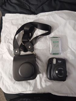 Polaroid camera with Kate and film