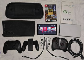 Nintendo Switch OLED with multiple accessories and games
