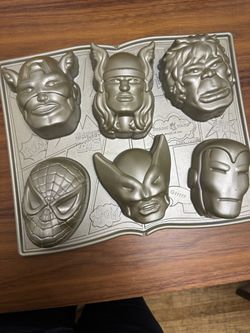 Nordic Ware Marvel Comics Cakelet Pan featuring the faces of six classic superheroes