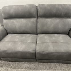 Gray suede dual electric recliner couch 