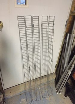 Five metal wall shelves 3” X 48” each