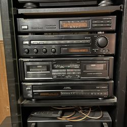 Onkyo Amplifier, 5 Disc Cd Changer, Cassette Player, And Record Player With Speakers