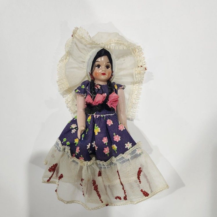 This a traditional Mexican doll, often referred to as a Lele or Maria doll.