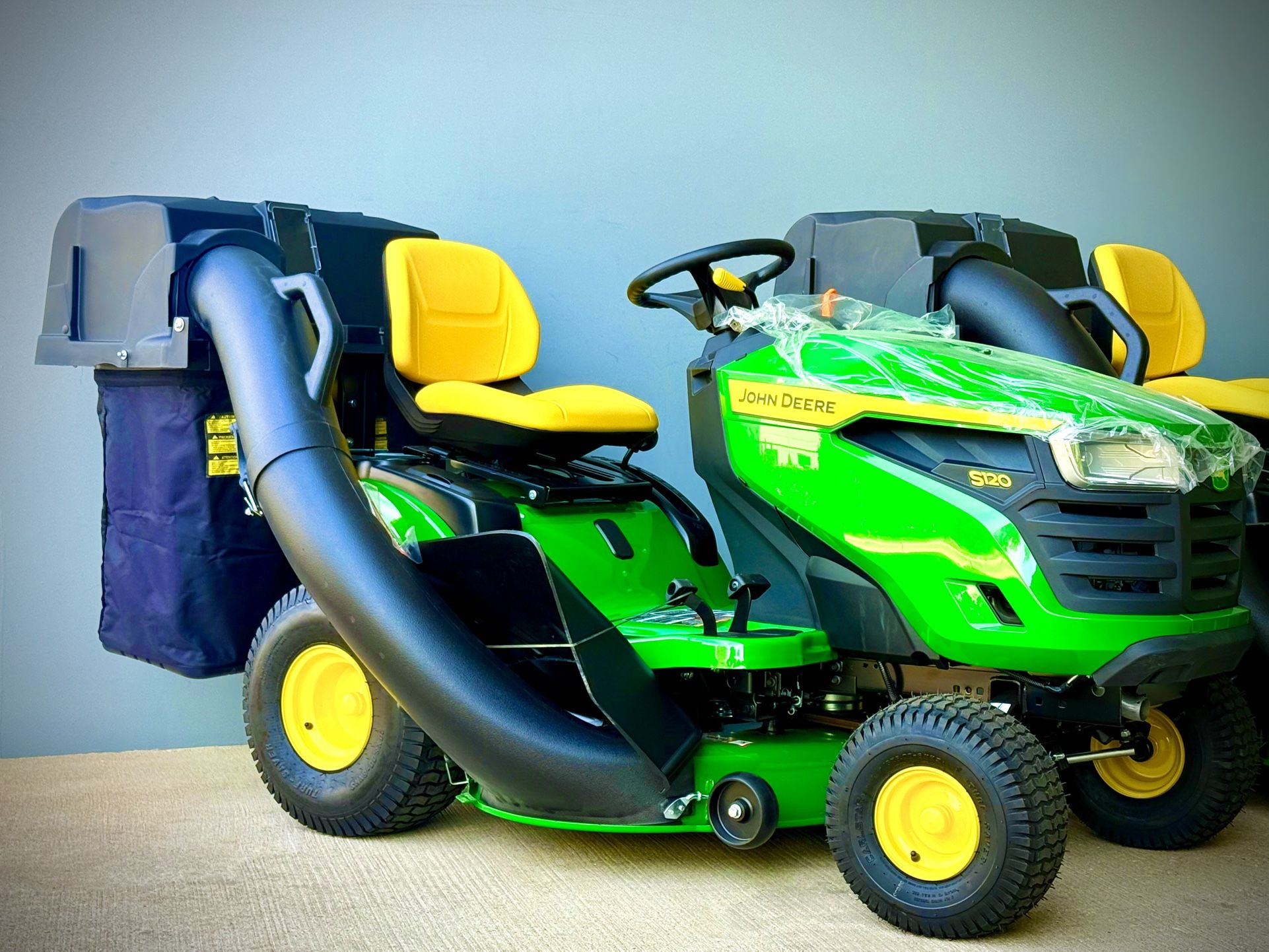 Brand new John Deere S120 42 in. 22 HP V-Twin Gas Hydrostatic Riding Lawn Mower comes with bagger. 