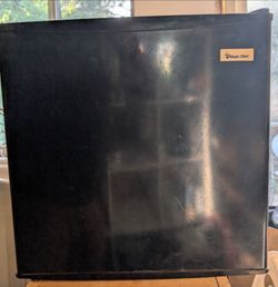Magic chef mini fridge with freezer compartment.