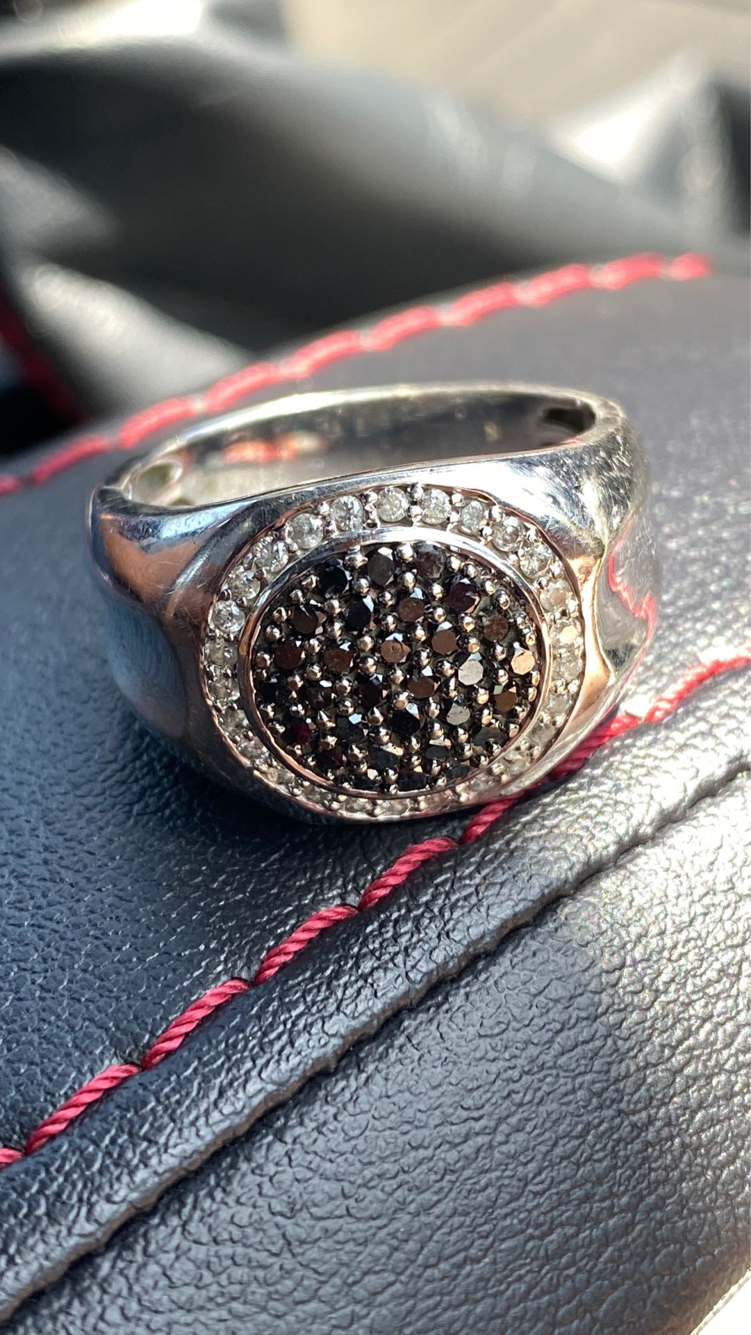 Gold men’s ring with black and white diamonds