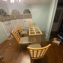 Glass top dining room table and 4 chairs. I’m moving and this must go!!