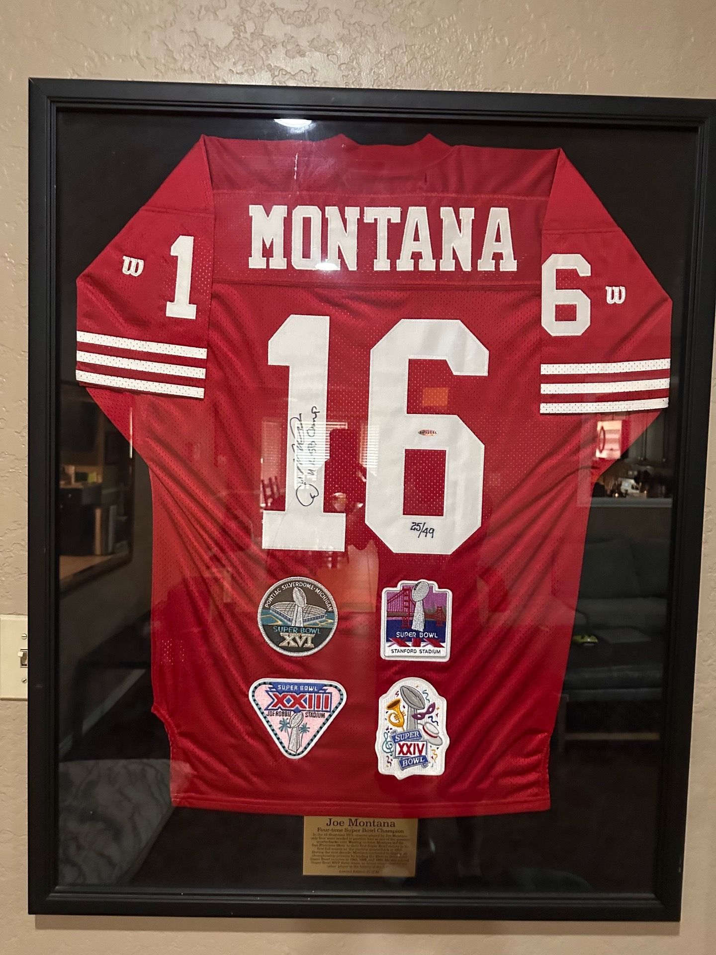 Framed signed Joe Montana jersey #25/49