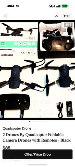 Two foldable quadcopter drones in black. Each features a forward camera and foldable arms. Includes two remotes, battery, USB cable, and manual. Great