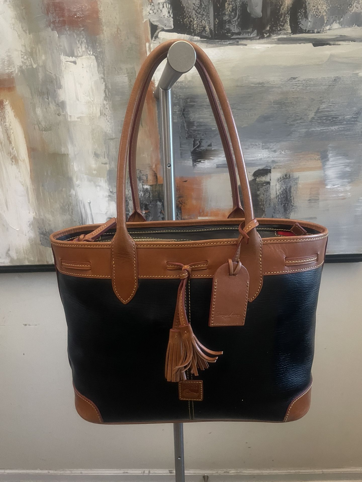 Dooney & Bourke Black Saffiano Tassel Bucket Tote Bag Black with a Tan Trim 