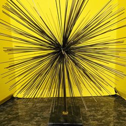 Mid-Century Modern starburst or "sea urchin" tabletop art piece. These designs, often characterized by radiating metal rods, became iconic in the 1960
