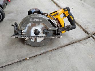 +1                    The selected tool is a DEWALT FLEXVOLT 60V MAX 7-1/4" Cordless Worm Drive Style Saw (model DCS577), featuring a rear-handle desi