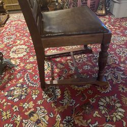 A Pair If Antique Hand Carved Chairs With Leather Seat