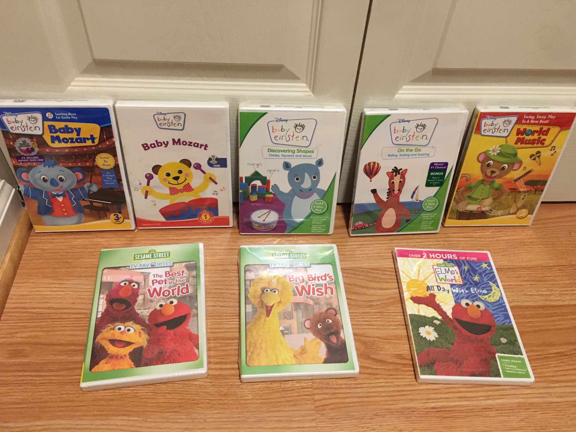 Lot of 8 NEW Baby Einstein and Sesame Street DVDs (new in packaging)