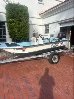 J12 Carolina skiff and 2015 25hp Suzuki 4 stroke efi