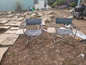 2 folding chairs with table on one side