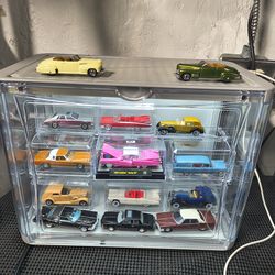 Toy Cadillac cars with display cases