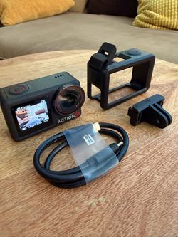 DJI Osmo Action 5 Pro 4K Action Camera with protective cage