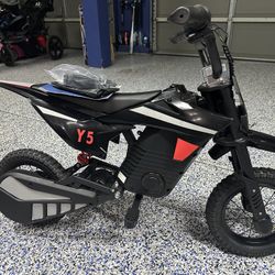 Y5- 36v 300 watt motor kids e moto dirt bike,16mph, up to 25 miles, rgb lighting & 10 inch tires.